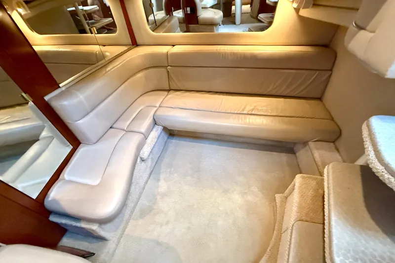 The Office Yacht Photos Pics Luxurious interior of 2003 Sea Ray 380 Sundancer with beige leather seating.