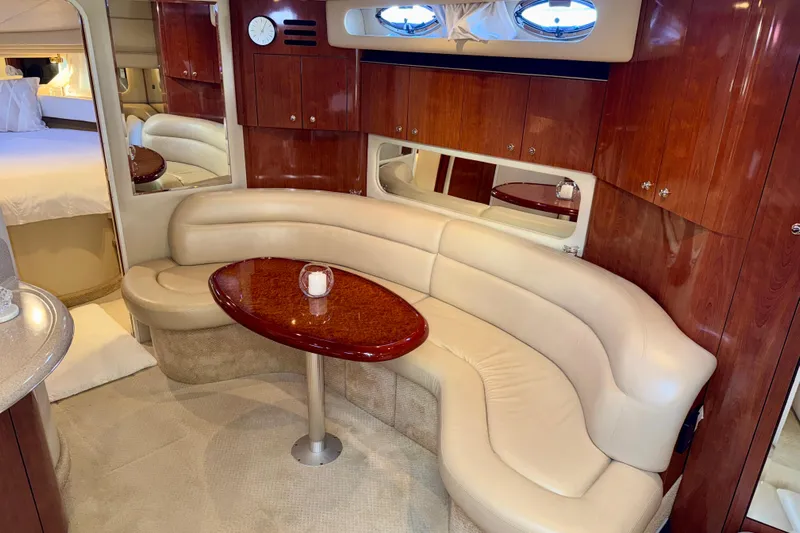 The Office Yacht Photos Pics Luxurious interior of 2003 Sea Ray 380 Sundancer yacht with plush seating and elegant wood finishes.