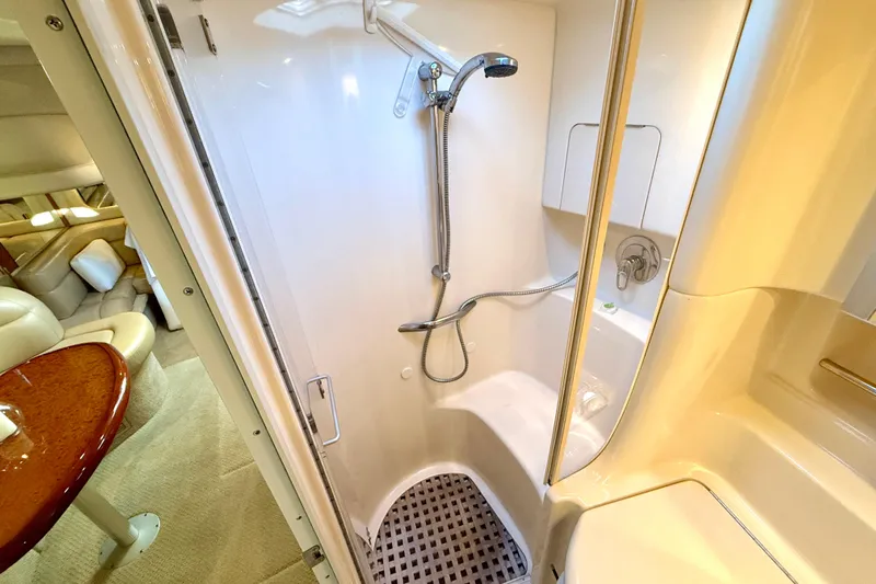 The Office Yacht Photos Pics Luxurious bathroom in 2003 Sea Ray 380 Sundancer yacht with shower and seating area.