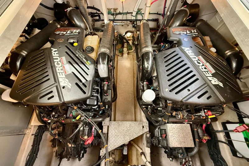 The Office Yacht Photos Pics Twin Mercury engines in a 2003 Sea Ray 380 Sundancer boat engine room.