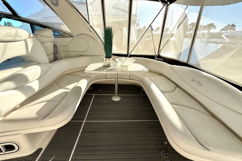 The Office Yacht Photos Pics Luxurious interior of 2003 Sea Ray 380 Sundancer yacht with elegant seating and table.