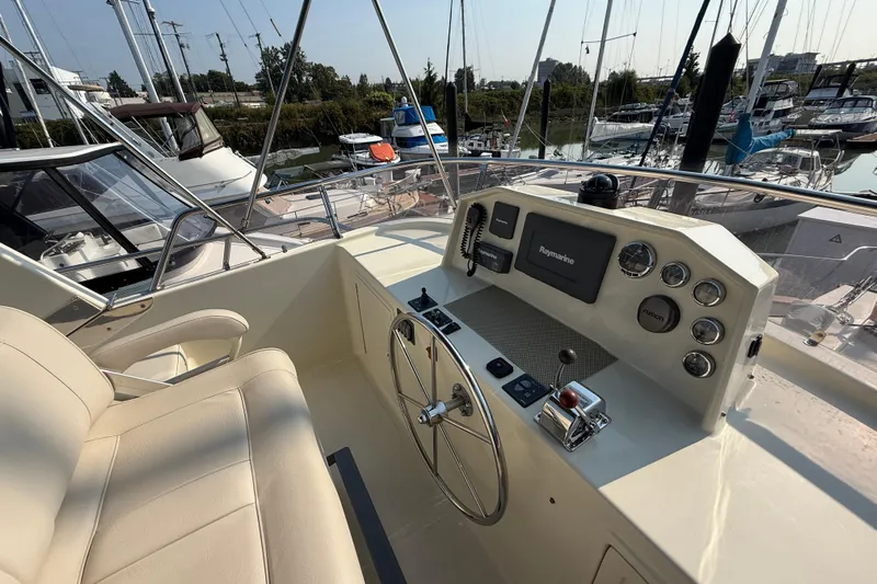 Raven Song Yacht Photos Pics Helm of 2011 North Pacific 38 Sedan yacht with navigation equipment and controls.