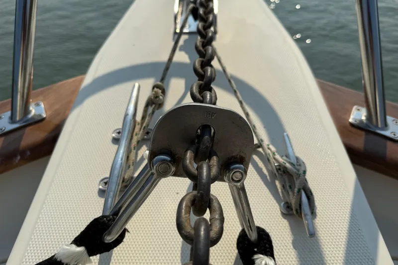 Raven Song Yacht Photos Pics Anchor chain and cleats on 2011 North Pacific 38 Sedan boat deck.