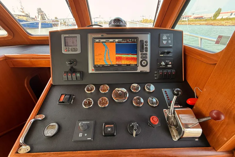 Raven Song Yacht Photos Pics Helm of 2011 North Pacific 38 Sedan with navigation and control instruments.