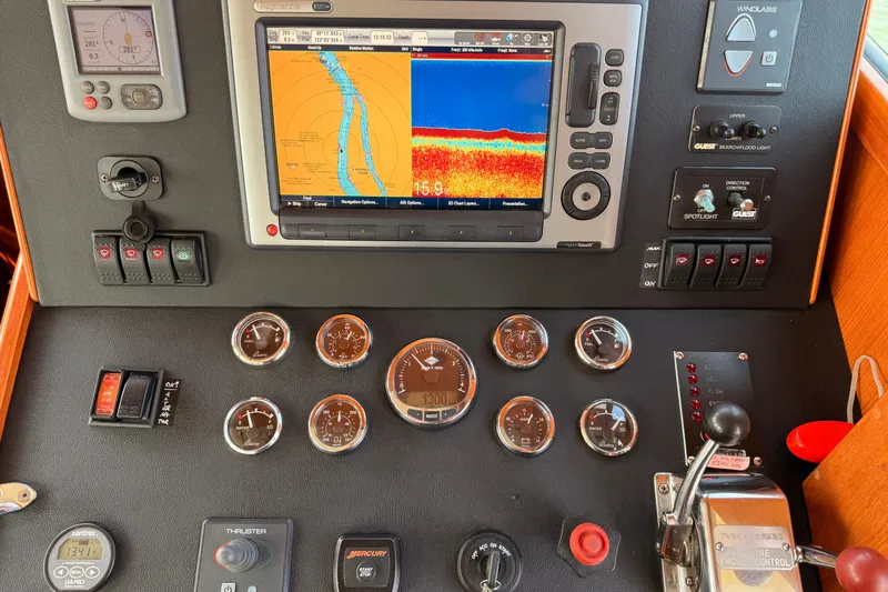 Raven Song Yacht Photos Pics Control panel of a 2011 North Pacific 38 Sedan with navigation and engine gauges.