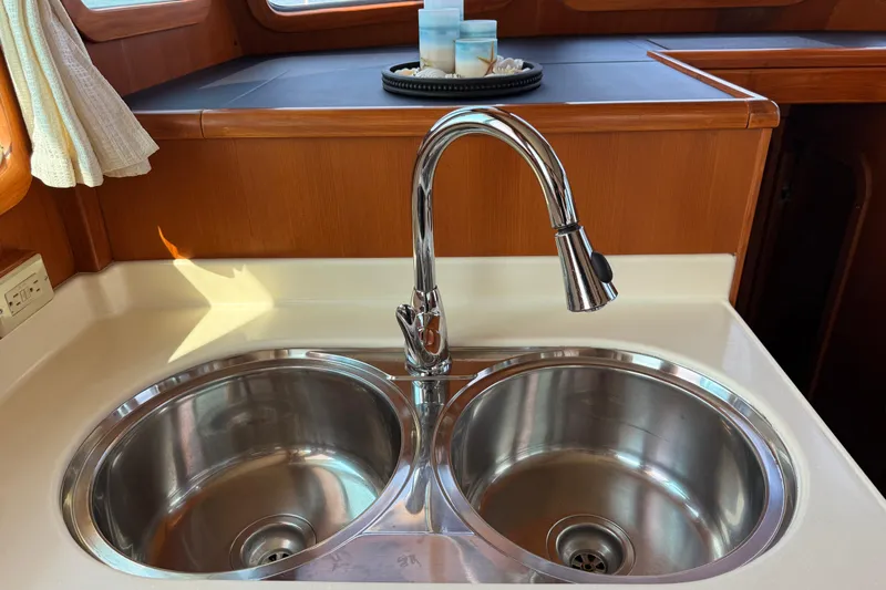 Raven Song Yacht Photos Pics Stainless steel double sink in 2011 North Pacific 38 Sedan yacht kitchen.