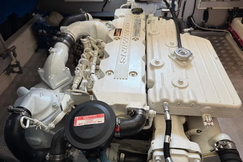 Raven Song Yacht Photos Pics Engine compartment of a 2011 North Pacific 38 Sedan boat, featuring a Cummins engine.