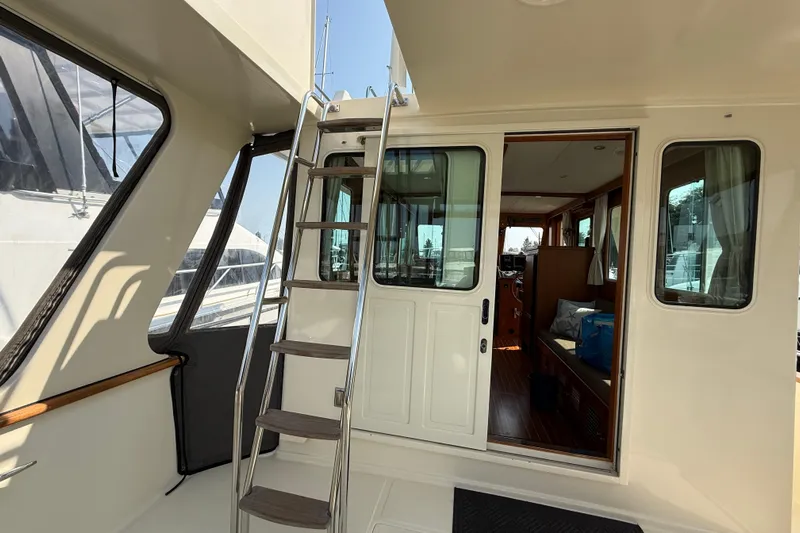 Raven Song Yacht Photos Pics 2011 North Pacific 38 Sedan yacht interior with ladder and sliding door.