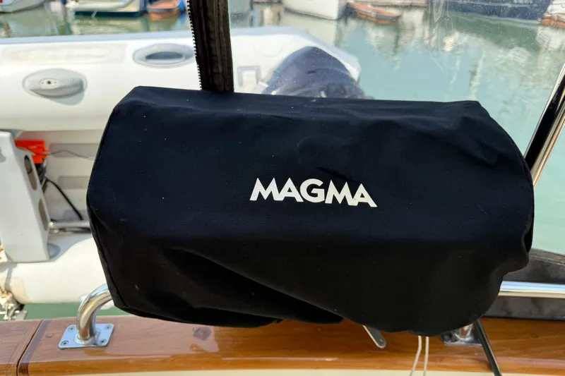 Raven Song Yacht Photos Pics Black Magma grill cover on a 2011 North Pacific 38 Sedan boat.