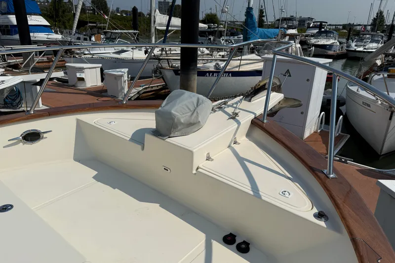 Raven Song Yacht Photos Pics 2011 North Pacific 38 Sedan yacht deck with railing, docked at marina.