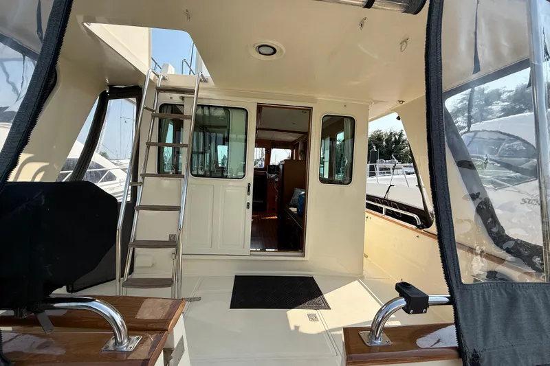 Raven Song Yacht Photos Pics 2011 North Pacific 38 Sedan yacht interior with ladder and open door view.