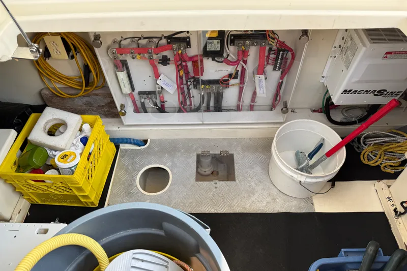 Raven Song Yacht Photos Pics Electrical panel and storage area in a 2011 North Pacific 38 Sedan boat.