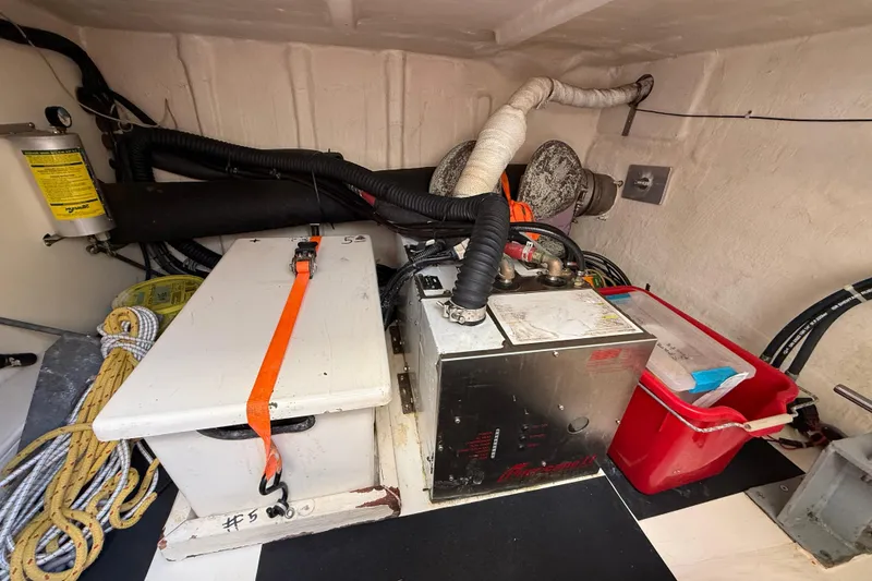 Raven Song Yacht Photos Pics Engine room of 2011 North Pacific 38 Sedan with equipment and storage.