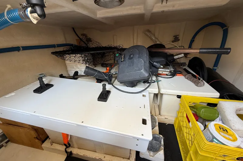 Raven Song Yacht Photos Pics Storage area in a 2011 North Pacific 38 Sedan boat with various equipment and supplies.
