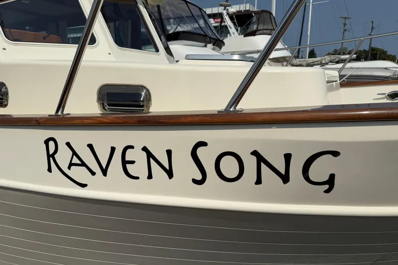 Raven Song Yacht Photos Pics 2011 North Pacific 38 Sedan boat named "Raven Song" docked at marina.