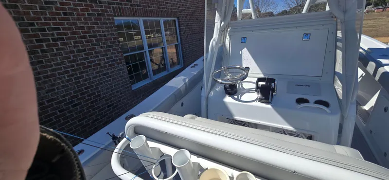  Yacht Photos Pics 2017 Yellowfin 36 boat interior with steering wheel and rod holders.