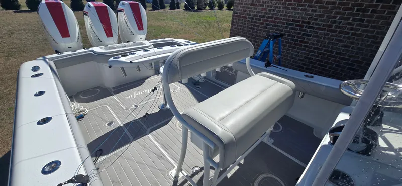  Yacht Photos Pics 2017 Yellowfin 36 boat interior with seating and triple outboard engines.