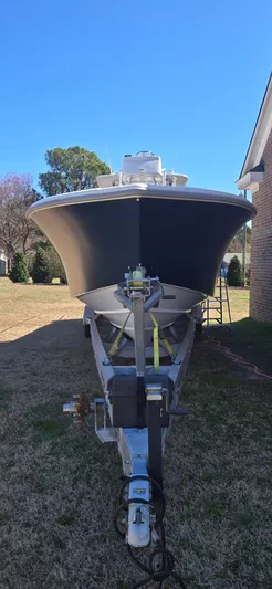  Yacht Photos Pics 2017 Yellowfin 36 boat on trailer, parked outdoors under clear blue sky.