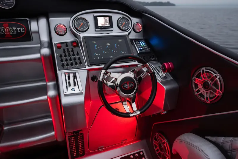  Yacht Photos Pics Cockpit of 2016 Cigarette 50' Marauder with illuminated controls and steering wheel.
