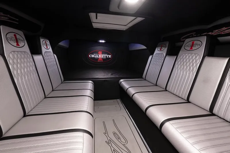  Yacht Photos Pics Interior of 2016 Cigarette 50' Marauder with luxurious white seating and branded details.