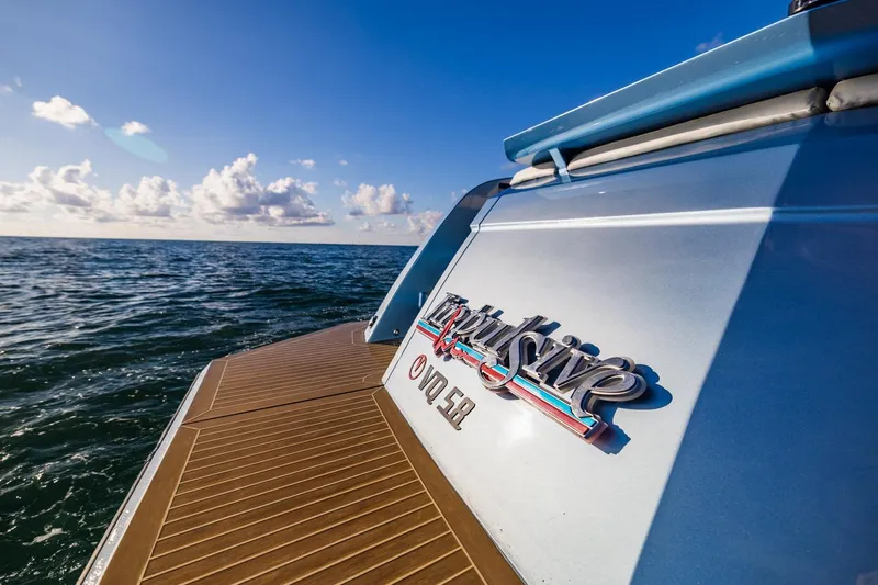 Impulsive Yacht Photos Pics 2019 Vanquish Yachts VQ58 on open sea, showcasing sleek design and luxury features.