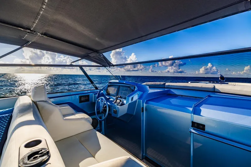 Impulsive Yacht Photos Pics Luxurious 2019 Vanquish Yachts VQ58 interior with ocean view and modern helm.