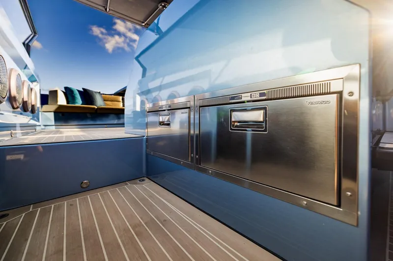 Impulsive Yacht Photos Pics Luxurious 2019 Vanquish Yachts VQ58 interior with sleek stainless steel appliances and modern design.