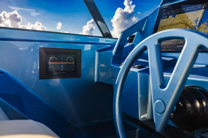 Impulsive Yacht Photos Pics Cockpit of 2019 Vanquish Yachts VQ58 with modern navigation displays and steering wheel.