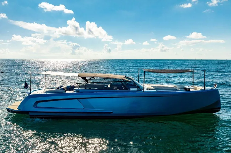 Impulsive Yacht Photos Pics 2019 Vanquish Yachts VQ58 luxury yacht cruising on a sunny ocean.