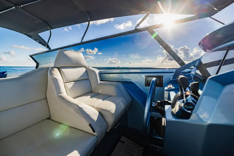 Impulsive Yacht Photos Pics Luxurious interior of 2019 Vanquish Yachts VQ58 with ocean view and sunlight.