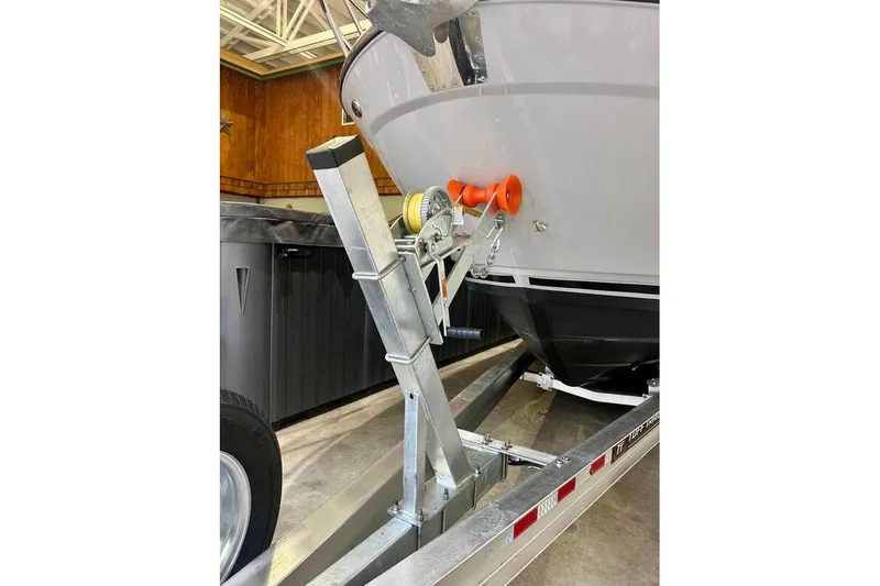  Yacht Photos Pics 2025 Cutwater C-248 Coupe boat on trailer, close-up of bow and winch system.