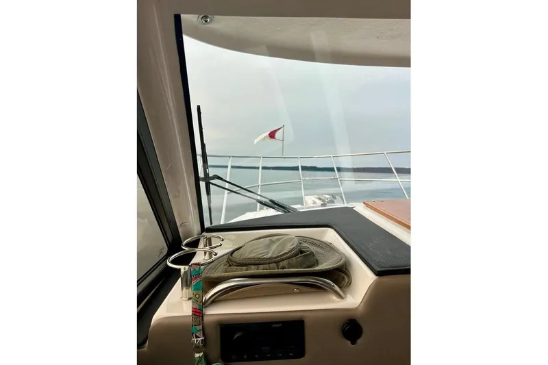  Yacht Photos Pics Interior view of 2025 Cutwater C-248 Coupe boat, showing dashboard and ocean horizon.