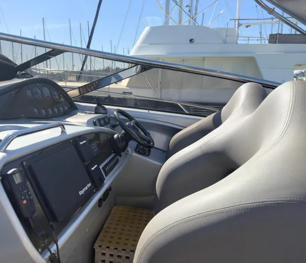  Yacht Photos Pics Interior cockpit of 2007 Sunseeker Superhawk 43 yacht with modern controls and seating.