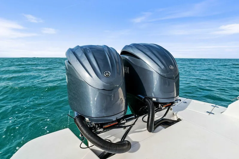  Yacht Photos Pics Twin outboard engines on a 2023 Regal 29 OBX boat, cruising on open water.