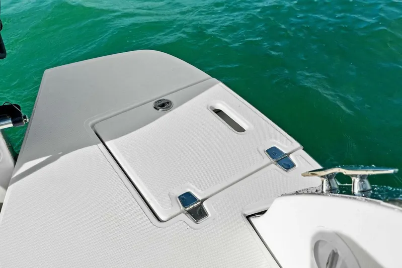  Yacht Photos Pics 2023 Regal 29 OBX boat deck with sleek design on turquoise water.