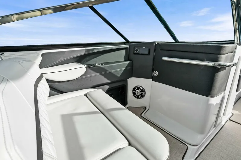  Yacht Photos Pics 2023 Regal 29 OBX boat interior with sleek white seating and modern design.