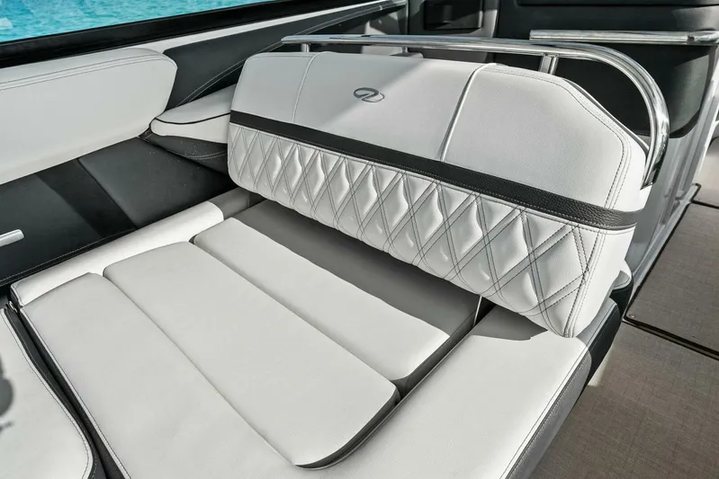  Yacht Photos Pics Luxurious seating on 2023 Regal 29 OBX boat with elegant white upholstery.