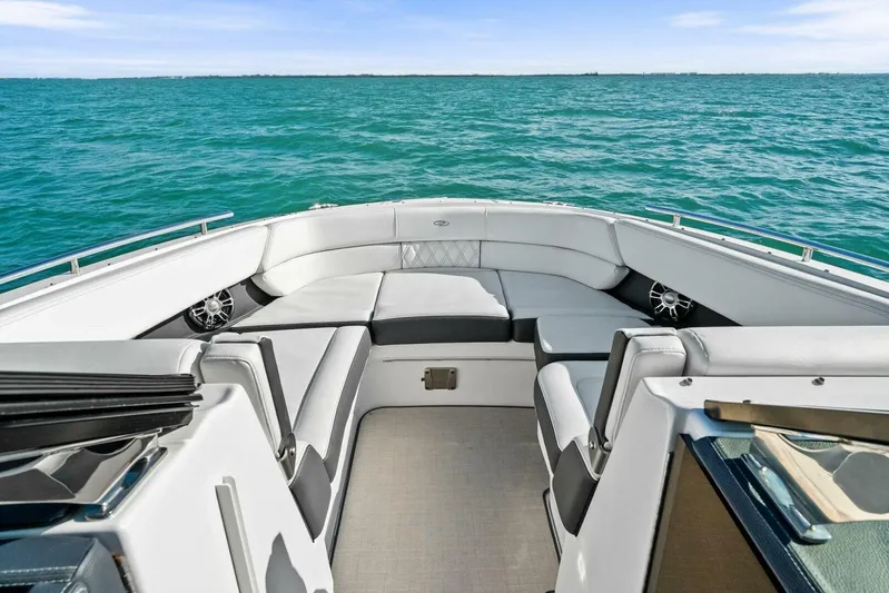  Yacht Photos Pics 2023 Regal 29 OBX boat interior with spacious seating on open water.