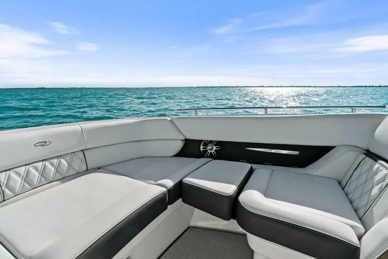  Yacht Photos Pics Luxurious seating on 2023 Regal 29 OBX boat with ocean view.
