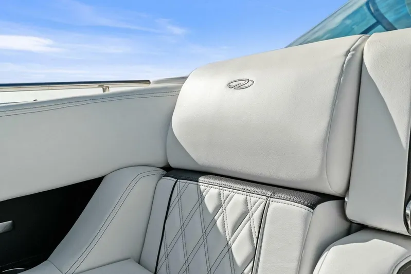  Yacht Photos Pics Luxurious seating on 2023 Regal 29 OBX boat with elegant stitching and logo.