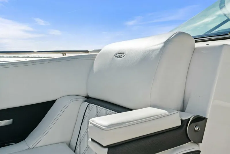  Yacht Photos Pics Luxurious white seating on 2023 Regal 29 OBX boat under clear blue sky.