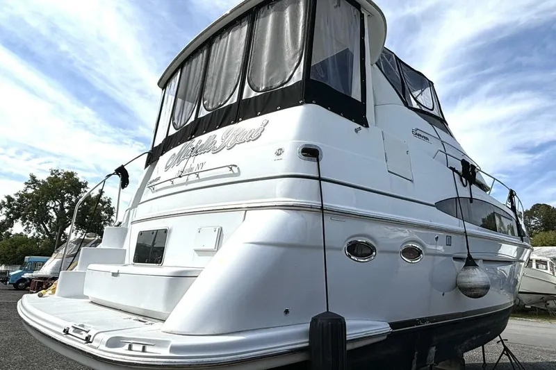  Yacht Photos Pics 2003 Carver 396 Motor Yacht with sleek design, docked under a blue sky.
