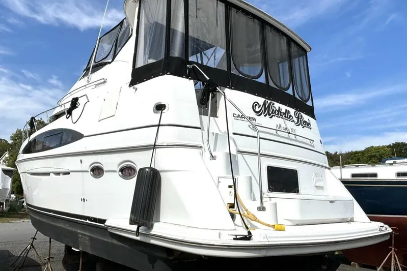  Yacht Photos Pics 2003 Carver 396 Motor Yacht on land, featuring sleek design and spacious cabin.