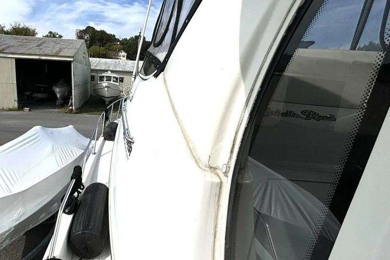  Yacht Photos Pics 2003 Carver 396 Motor Yacht docked near storage buildings.