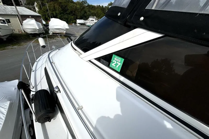  Yacht Photos Pics 2003 Carver 396 Motor Yacht docked, featuring sleek design and New York registration sticker.