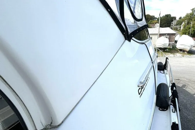  Yacht Photos Pics 2003 Carver 396 Motor Yacht side view, showcasing sleek design and docked setting.