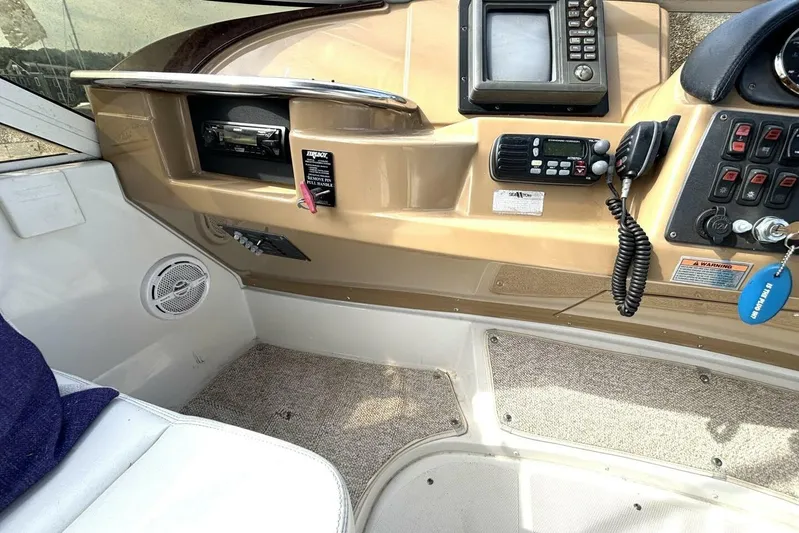  Yacht Photos Pics Interior helm of 2003 Carver 396 Motor Yacht with navigation equipment and controls.