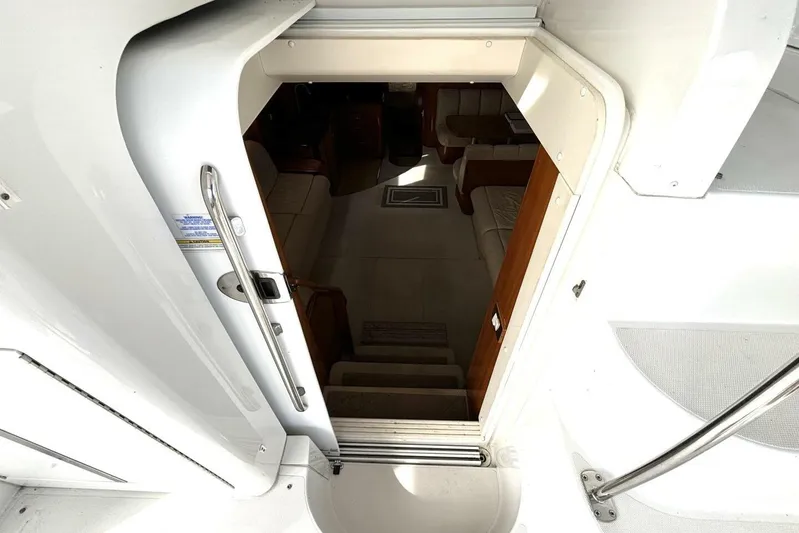  Yacht Photos Pics Entrance to 2003 Carver 396 Motor Yacht interior, showing stairs and seating area.