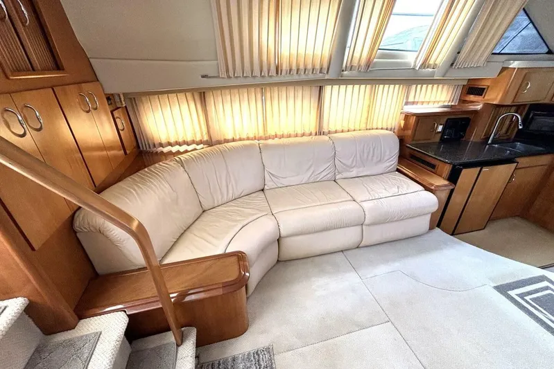  Yacht Photos Pics Luxurious interior of 2003 Carver 396 Motor Yacht with plush seating and elegant wood finishes.