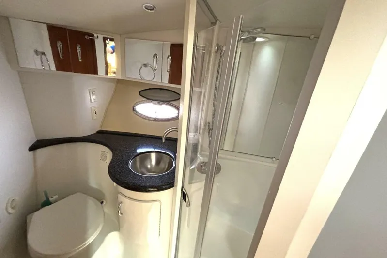  Yacht Photos Pics 2003 Carver 396 Motor Yacht bathroom with sink, toilet, and shower.